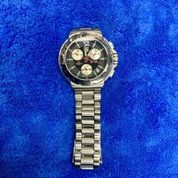 TAG Heuer CAC1111B-0 Quartz Chronograph Date Black Dial Mens Watch 39.0mm Indy 500 Swiss Made Stainless Steel Band Bezel Water Resistant 200m 