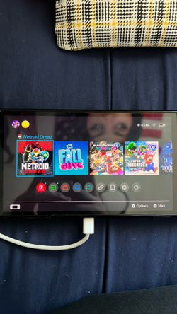 Nintendo Switch with White Joy-Con and Black Grip USB cord included
