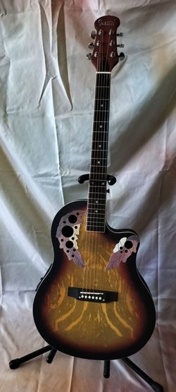 Brand new acoustic electric guitar with new bag, cable and shoulder strap