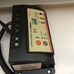 Mobile solar panel, power generator with charge controller, and charging cable, self contain in suitcase design