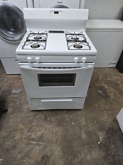 whirlpool Four Burner white gas stove.