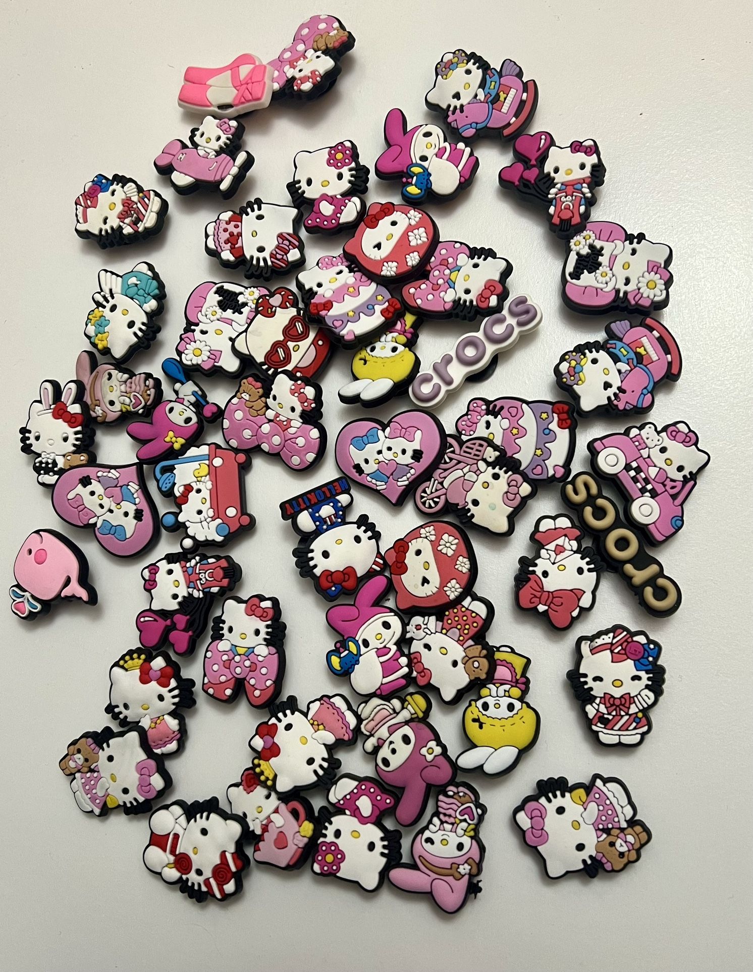 50 Hello kitty croc charms all for $20