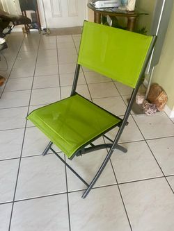 Folding chair, end table, metal art