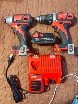 Milwaukee M-18 impact and drill  guns with 1.5 amp battery and charger