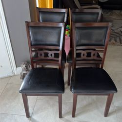 Four piece wooden kitchen table with chairs