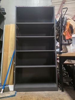 Tall metal shelf with height adjustable metal shelf boards