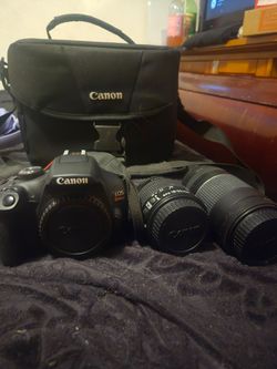 Canon Rebel T7 bundle 2 lenses 2 batteries charger bag and tripod