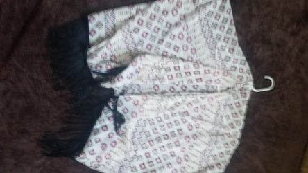 Womens white patterned poncho with black fringe