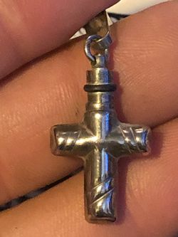 Cross pendent with secret chamber