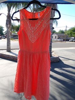 Orange girls dress medium. Pink dress is. Medium