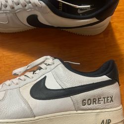 pair of Nike Air Force 1 Low GORE-TEX sneakers in a white and black colorway