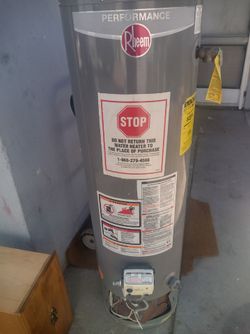 USED 28 GAL. WATER HEATER $100
