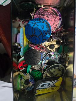 Box of pokemon coins and pins