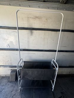 White metal storage rack with fabric shelves