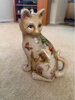 Vintage ceramic cat figurine with hand painted floral and butterfly details