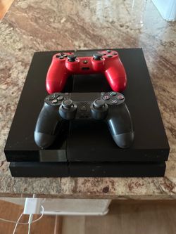 Sony PlayStation 4 Console with Two Controllers