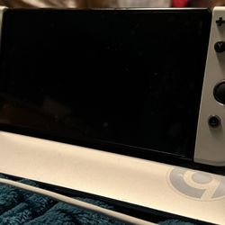 Nintendo Switch OLED White with additional pair of Joycons and Mario Kart Case