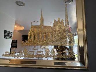 Gold trimmed Glass mirror with the Eiffel Tower and a church