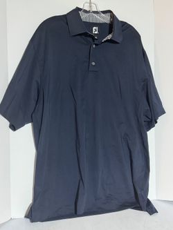 Foot Joy navy blue Golf polo with Stonecreek logo on sleeve