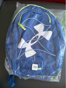 New Under Armour backpack is blue with a white logo and lime green accents. It is made of a durable synthetic fabric and has adjustable shoulder strap