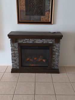 Electric Fireplace with Stone Surround and Wood Mantel