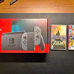 Nintendo Switch (In original box) + Zelda Breath of the wild + Super Smash Bros Ultimate