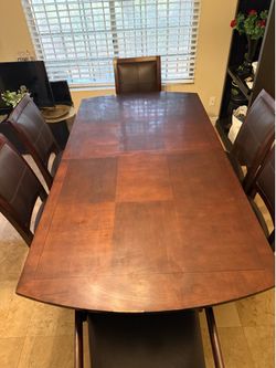 Dining room table, 6 chairs and extenders