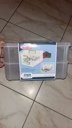 Sterilite Stack & Carry 2-Layer Handle Box featuring a clear plastic design with green latches.