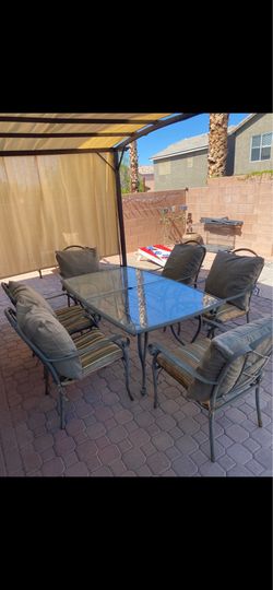 Outside doors, six chairs with table