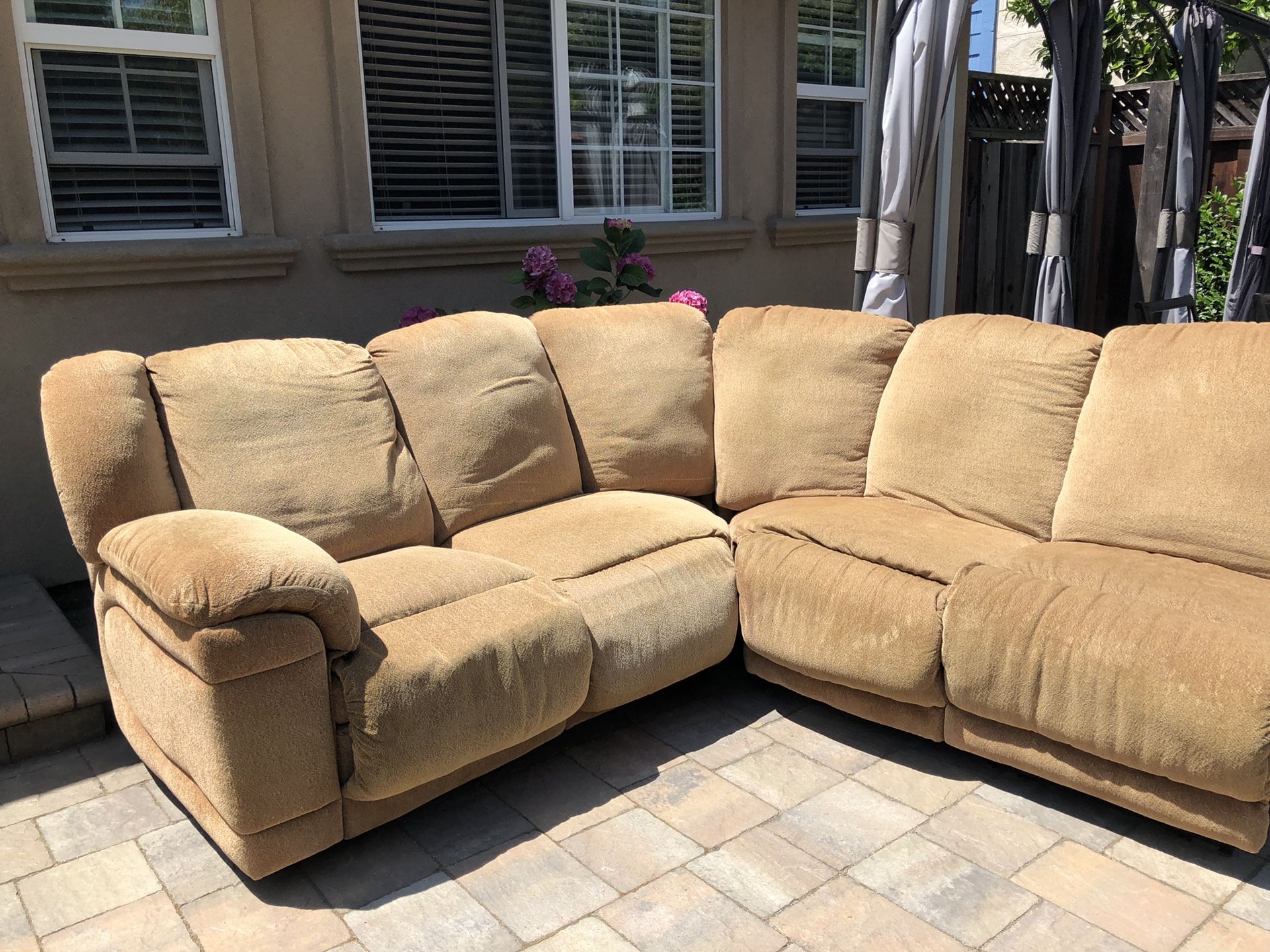 Sectional couch with three recliners.