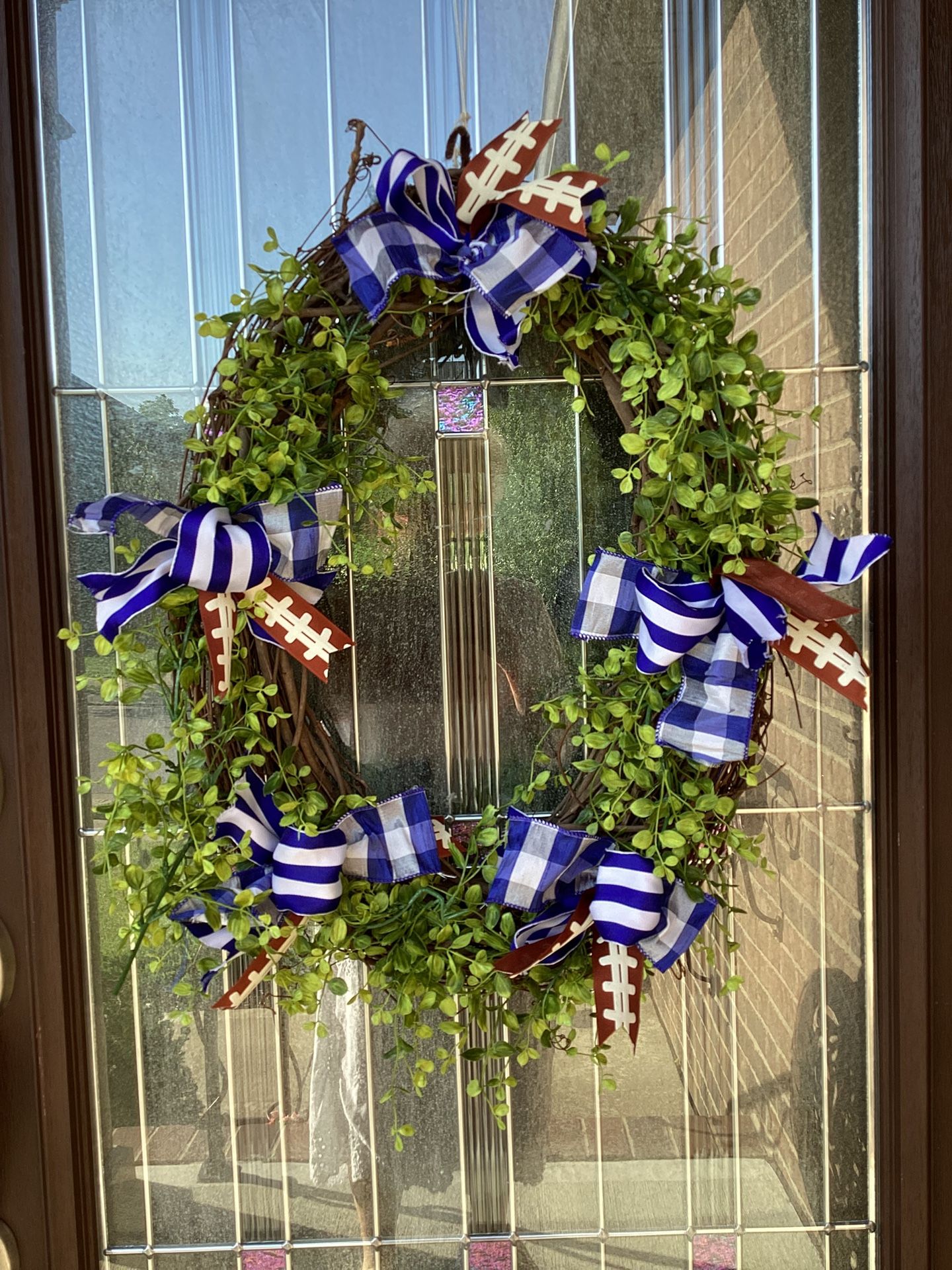 Oval Wreath with football ribbons 23” x 18”
