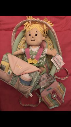 Baby Stella blonde soft baby doll, snuggle up front carrier, comfort car seat and darling baby doll diaper bag