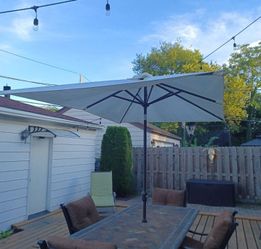 Sunrise..  Large rectangle, crank up light up umbrella with heavy duty steel center stand