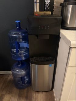 Water dispenser with three 5 gallon jugs