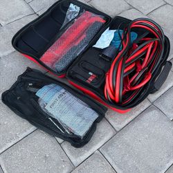 Bridgestone emergency car kit. Includes jumper cables, small air pump, road reflectors, small first aid kit.
