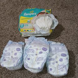 Luvs, Pampers Diapers. Size 2-3