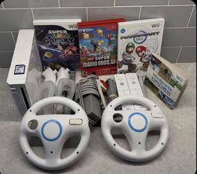 NINTENDO WII + MARIO KART,MARIO BROS.MARIO GALAXY,WII SPORTS and More