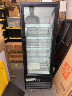 Two small safes and a Single Glass Door Merchandiser Refrigerator