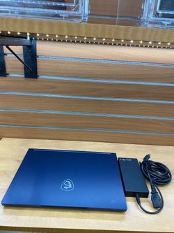 MSI Stealth 16Studio A13VG laptop running Windows 11.