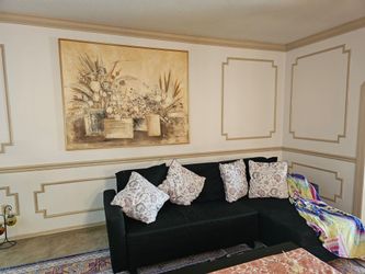 L shaped black sofa covert to bed