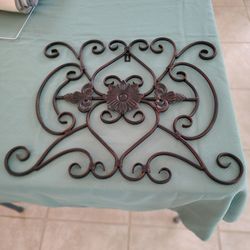 Brushed bronze wall decor.