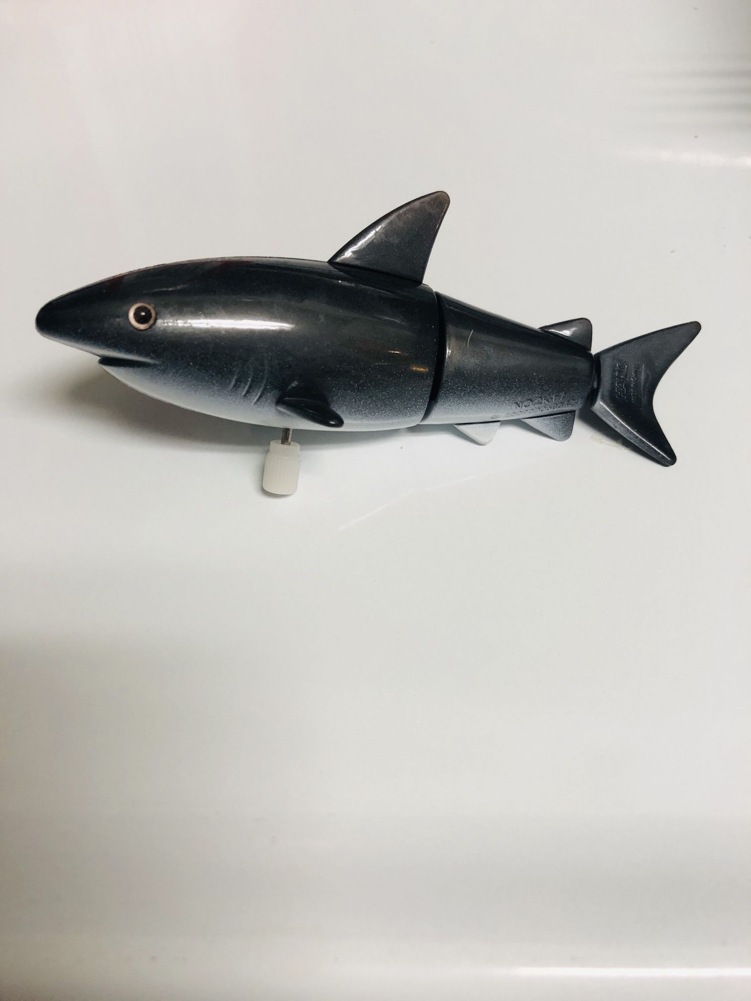 Wind up our dark grey Shark and he quickly flips her body and back fin