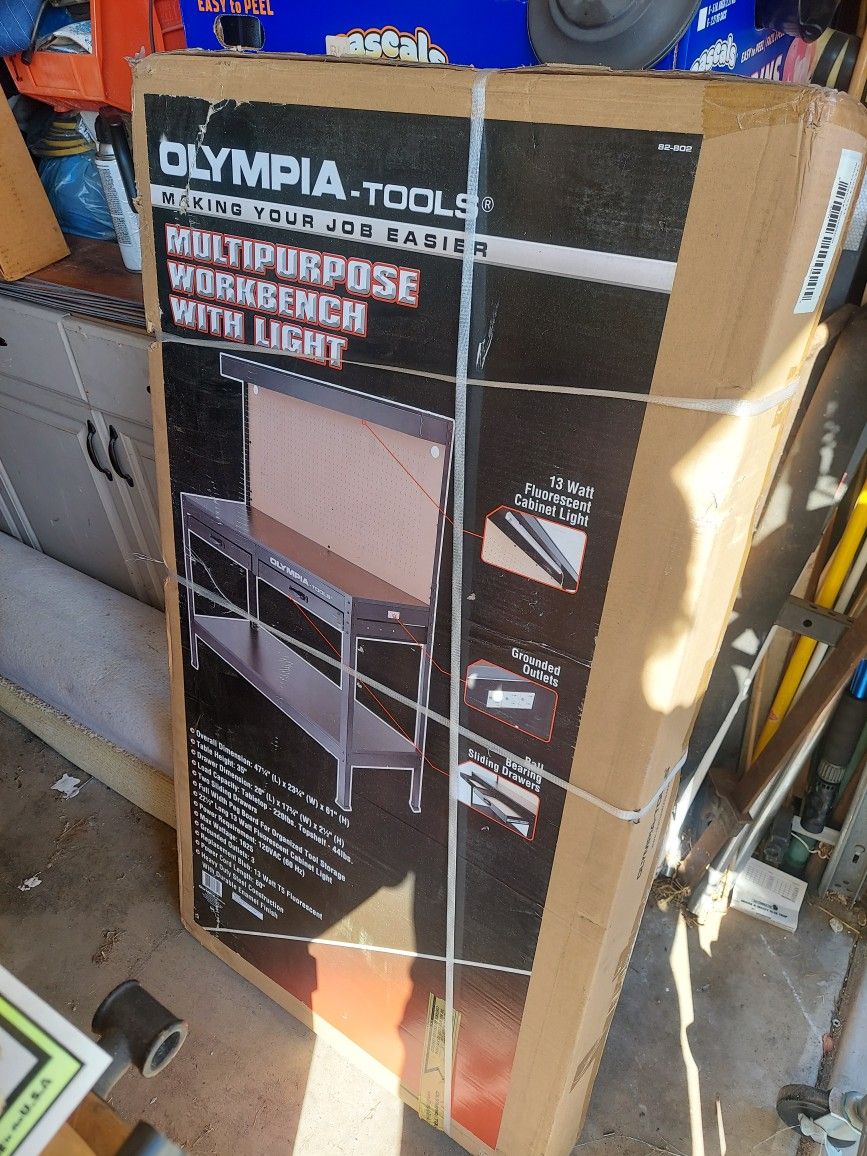 Olympia tools , multi purpose workbench with light and pegboard