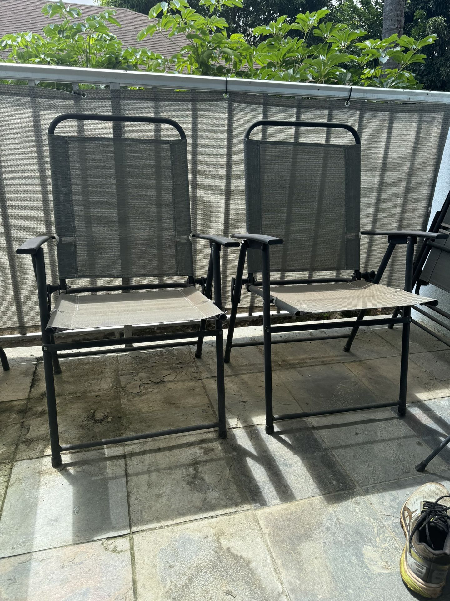 Glass patio/ Lanai Table and 4 Folding Chairs