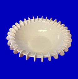 White ceramic bowl unique rim small discs
