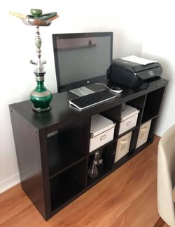 multiple use storage unit. can be used as a dresser, server or in the office and comes with fabric drawers