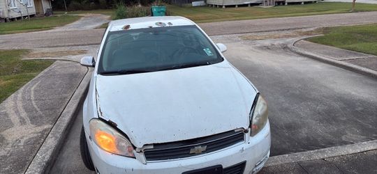 All white 2006 Chevy Impala