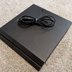 PS4 WITH GAMES AND CONTROLLER