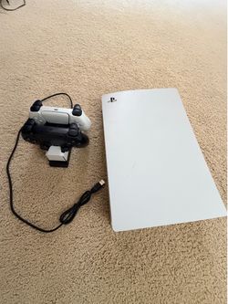 Ps5 2 controllers and a standing charging pad