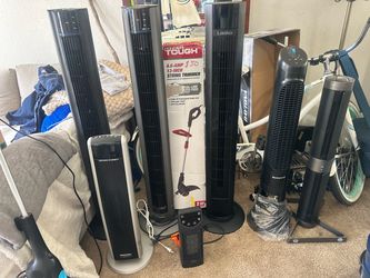 Lot of Tower Fans and Space Heaters
